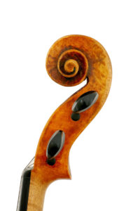Side view of scroll of Guarneri model violin made in 2019